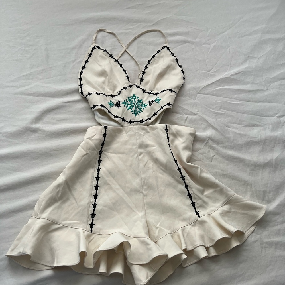 Fashion Nova - Ivory Embroidered Cut
Out Ruffle Hem Romper